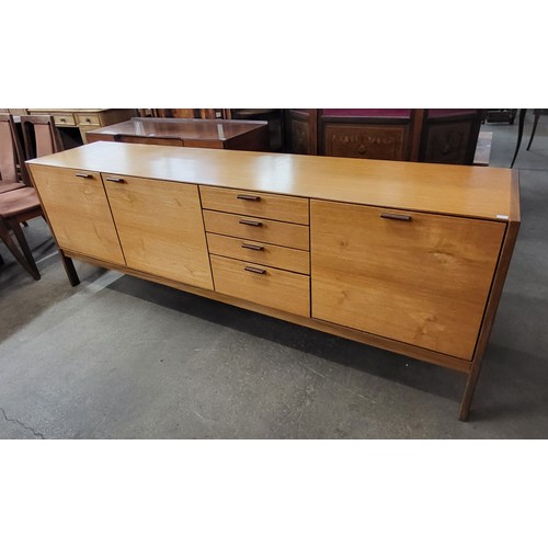 56 - A Meredew teak sideboard with stitched leather handles