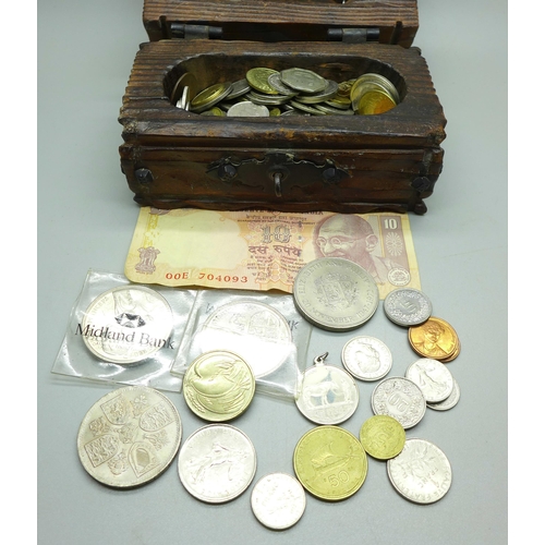 933 - A collection of British and foreign coins, with two euro coins