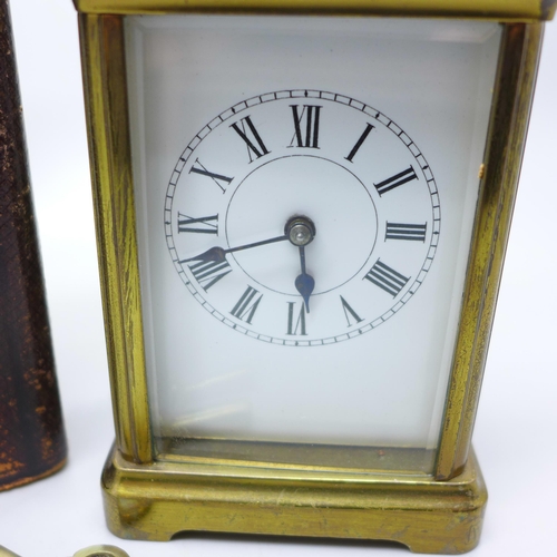 936 - A French gilt brass and four glass sided carriage clock in leather travel case