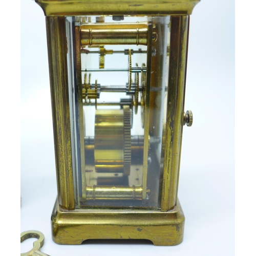 936 - A French gilt brass and four glass sided carriage clock in leather travel case