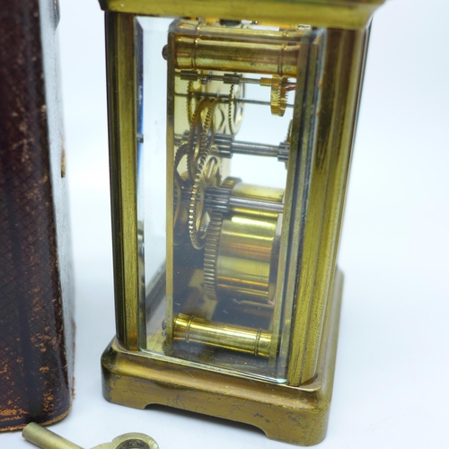 936 - A French gilt brass and four glass sided carriage clock in leather travel case