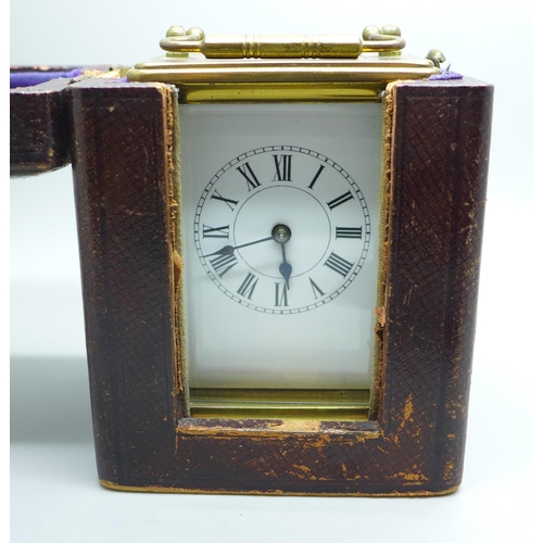 936 - A French gilt brass and four glass sided carriage clock in leather travel case