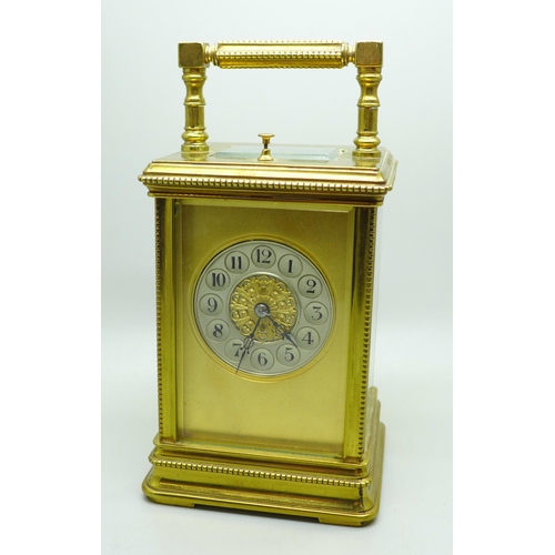 937 - A brass and four glass sided carriage clock with repeater, movement a/f