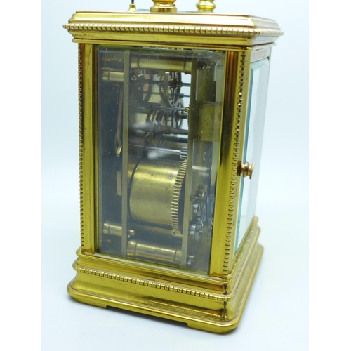 937 - A brass and four glass sided carriage clock with repeater, movement a/f