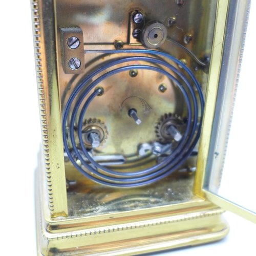 937 - A brass and four glass sided carriage clock with repeater, movement a/f