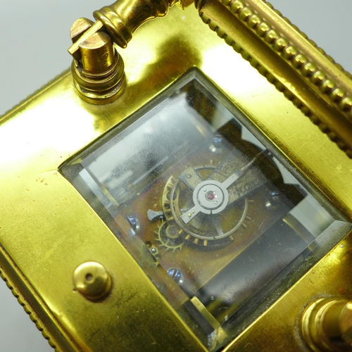 937 - A brass and four glass sided carriage clock with repeater, movement a/f