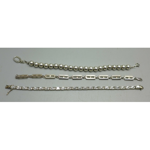 943 - Three silver bracelets, 42g