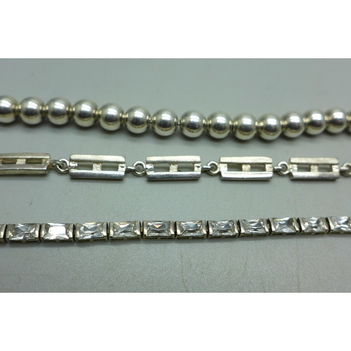 943 - Three silver bracelets, 42g