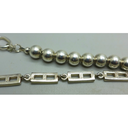 943 - Three silver bracelets, 42g