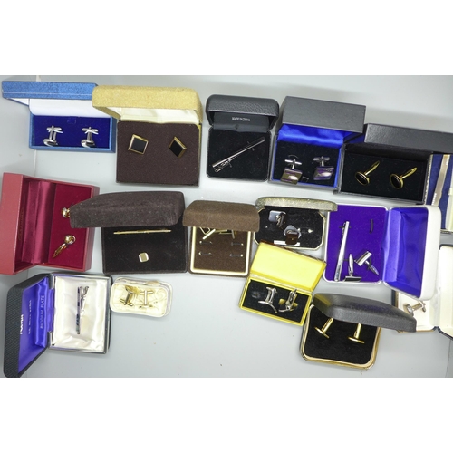 973 - Two boxes containing silver rings, charms and costume jewellery