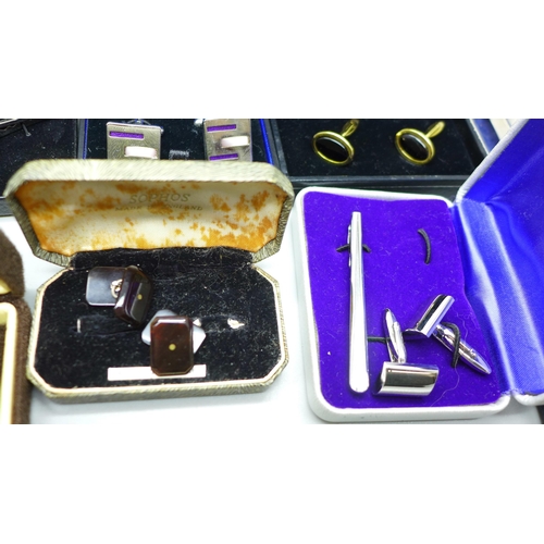 973 - Two boxes containing silver rings, charms and costume jewellery