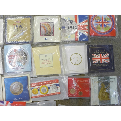 979 - Twenty-eight coin sets, dating from 1986-2006, including a Trafalgar commemorative crown, Coronation... 