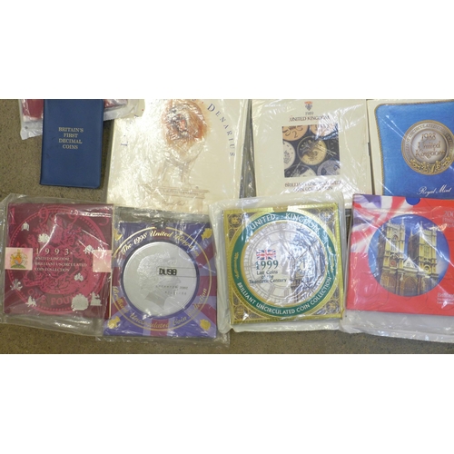 979 - Twenty-eight coin sets, dating from 1986-2006, including a Trafalgar commemorative crown, Coronation... 