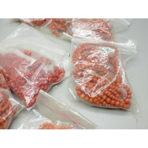 982 - A large collection of loose coral beads for stringing, 400g