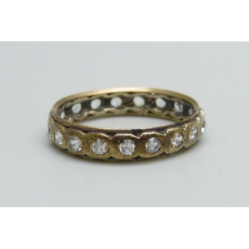 1011 - A 9ct gold eternity ring set with white stones, 2.5g, Q