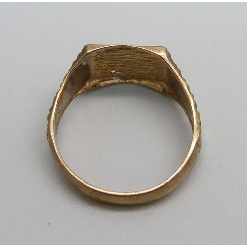 1023 - A 9ct gold and diamond signet ring, 2.7g, T