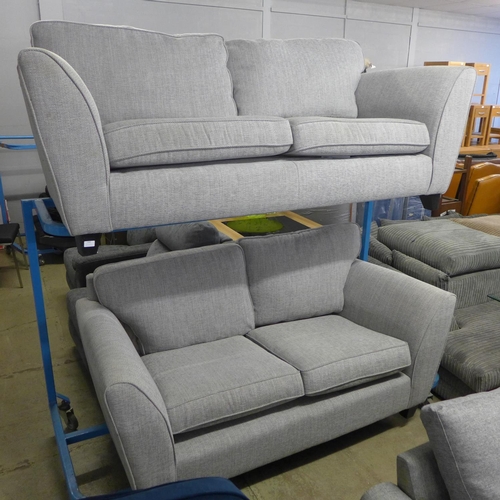 1560 - A pair of grey textured weave upholstered 2+3 seater sofas - damaged