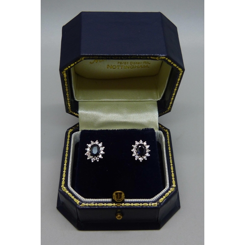 1028 - A pair of 9ct gold, sapphire and diamond earrings, 2.7g, 1cm clusters