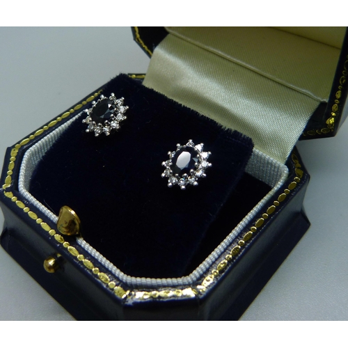 1028 - A pair of 9ct gold, sapphire and diamond earrings, 2.7g, 1cm clusters