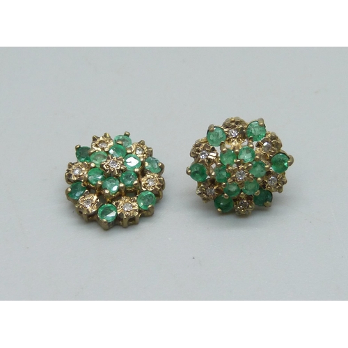 1032 - A pair of 9ct gold, diamond and emerald cluster stud earrings, 2.1g, one post requires repair