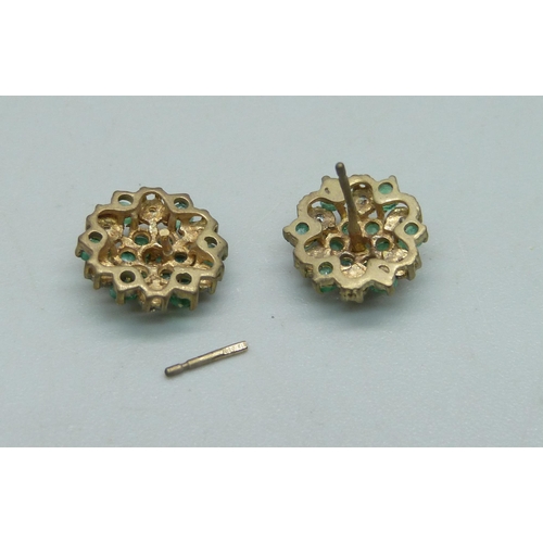 1032 - A pair of 9ct gold, diamond and emerald cluster stud earrings, 2.1g, one post requires repair