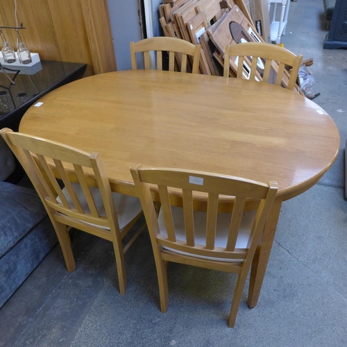 1590 - A beech dining table and four chairs