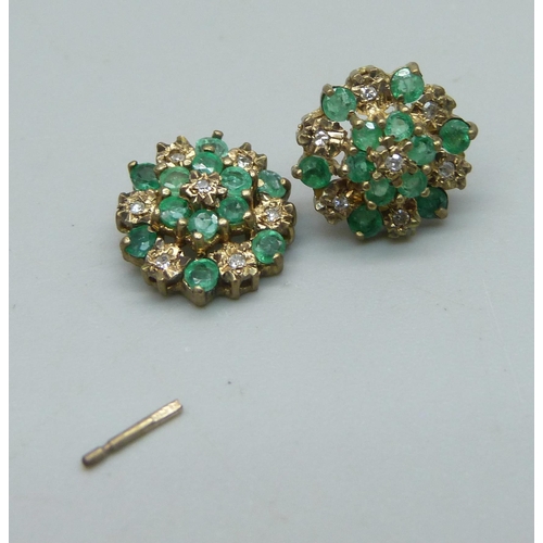 1032 - A pair of 9ct gold, diamond and emerald cluster stud earrings, 2.1g, one post requires repair