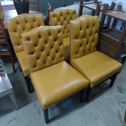 1604 - Four tan button back studded leather chairs