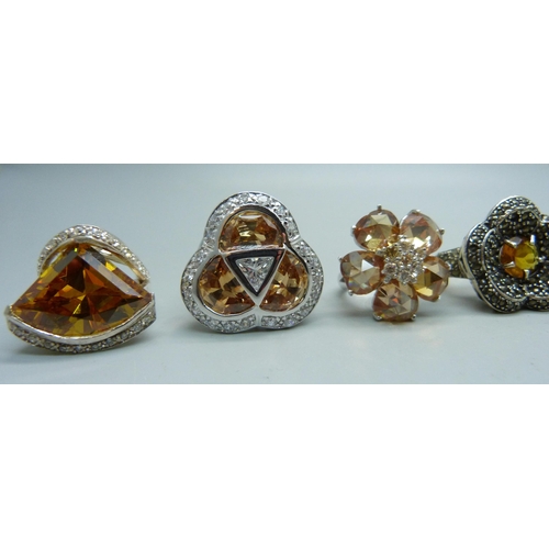 1058 - Nine chunky large silver rings, mostly set with citrine, 35mm, 118g