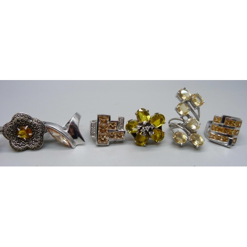 1058 - Nine chunky large silver rings, mostly set with citrine, 35mm, 118g