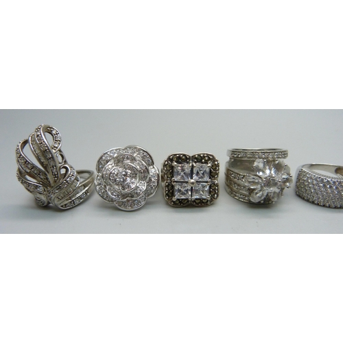 1059 - Nine chunky large silver rings set with cubic zirconia, quartz and marcasite, up to 30mm, 82g