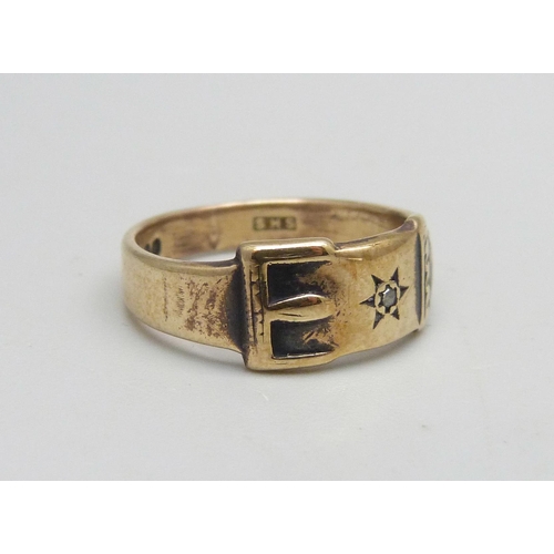 1069 - A 9ct gold buckle ring set with a diamond, 3g, J/K