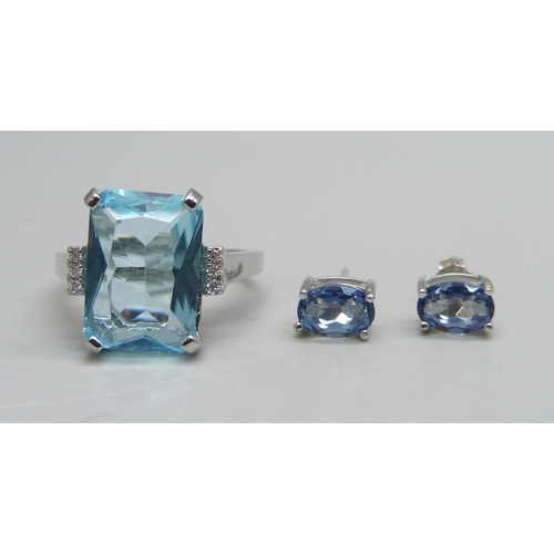 1072 - A silver ring set with a paste blue stone and small white stones, Q, and a pair of silver and blue s... 