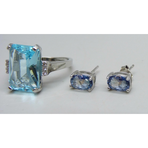 1072 - A silver ring set with a paste blue stone and small white stones, Q, and a pair of silver and blue s... 