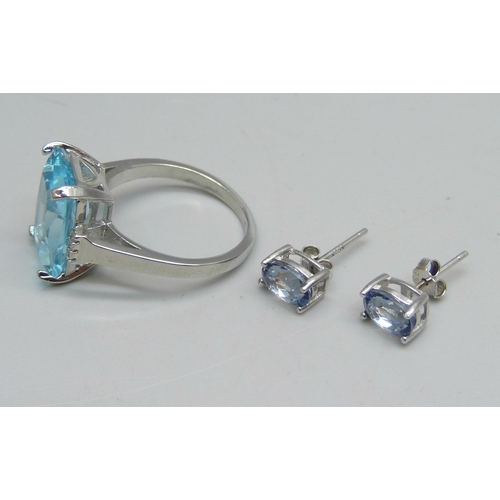 1072 - A silver ring set with a paste blue stone and small white stones, Q, and a pair of silver and blue s... 