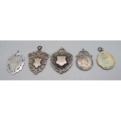 1073 - Four silver fobs including one enamelled example, and a white metal mounted coin pendant, loop a/f, ... 