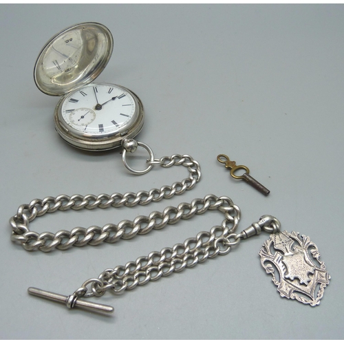 1082 - A silver cased full hunter pocket watch and a silver albert chain, chain and fob 63g, 32.5cm chain l... 