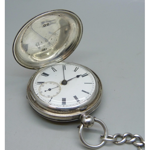 1082 - A silver cased full hunter pocket watch and a silver albert chain, chain and fob 63g, 32.5cm chain l... 