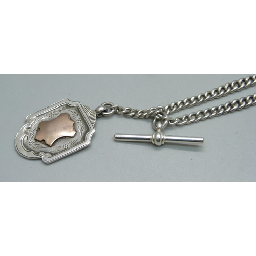 1090 - A silver double Albert chain and fob, 27g, 38cm including clips