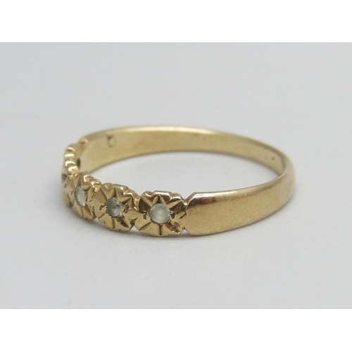 1094 - A 9ct gold ring set with five white stones, 1.6g, O