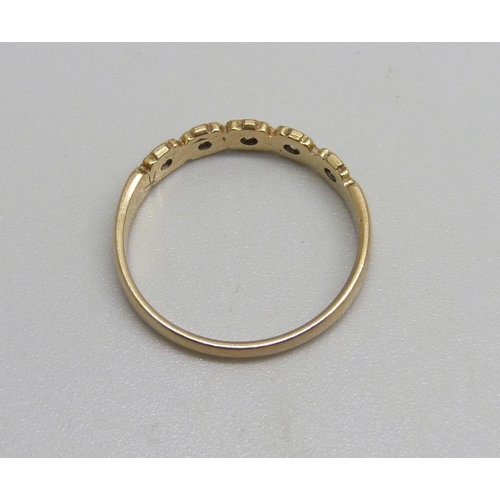 1094 - A 9ct gold ring set with five white stones, 1.6g, O