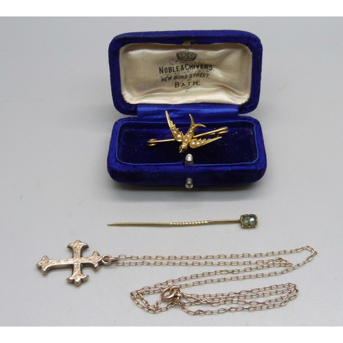 1102 - A gold plated cross pendant on a yellow metal chain, a yellow metal and seed pearl bird brooch, boxe... 