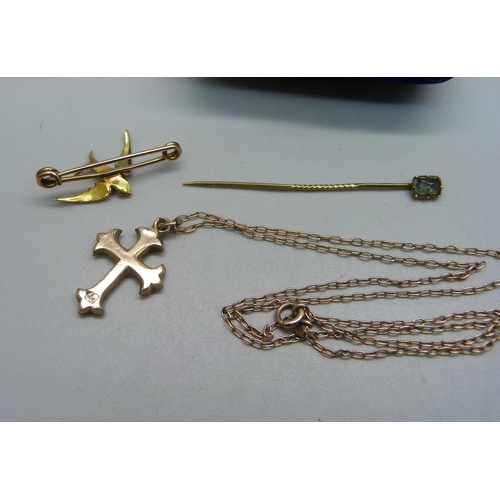 1102 - A gold plated cross pendant on a yellow metal chain, a yellow metal and seed pearl bird brooch, boxe... 