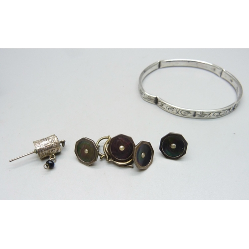 1105 - Four silver shirt studs with abalone inlay and set with pearls, and a silver bangle, a/f