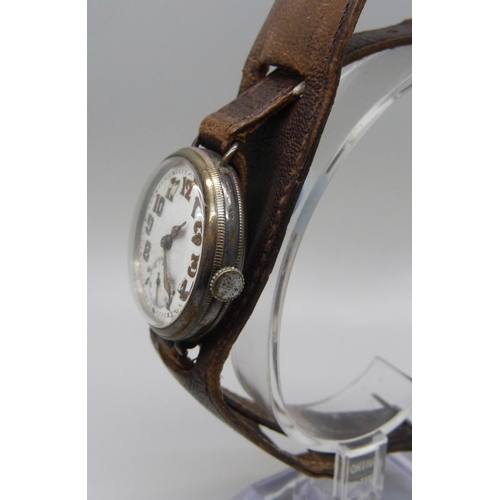 1106 - A silver cased trench watch on a leather strap