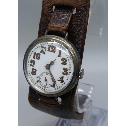 1106 - A silver cased trench watch on a leather strap