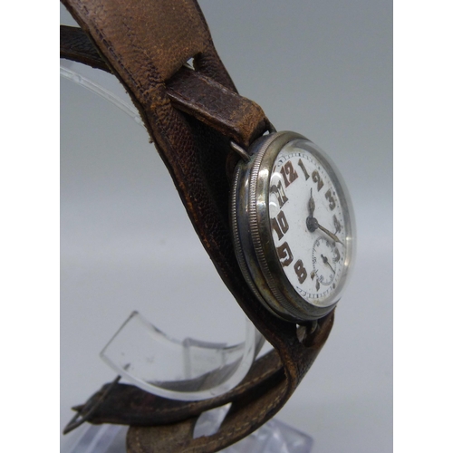 1106 - A silver cased trench watch on a leather strap