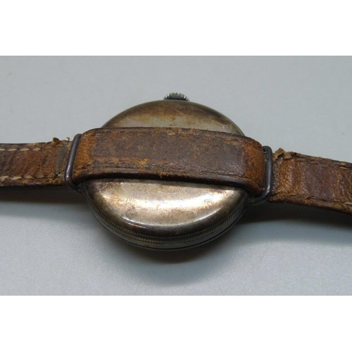 1106 - A silver cased trench watch on a leather strap