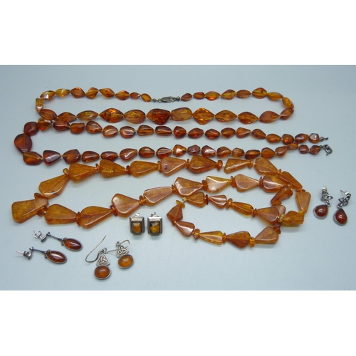 1112 - Three amber necklaces, one clasp a/f, three pairs of white metal and amber earrings, and one pair ma... 