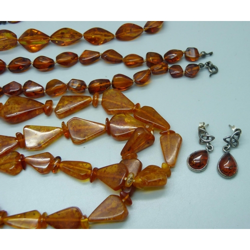 1112 - Three amber necklaces, one clasp a/f, three pairs of white metal and amber earrings, and one pair ma... 